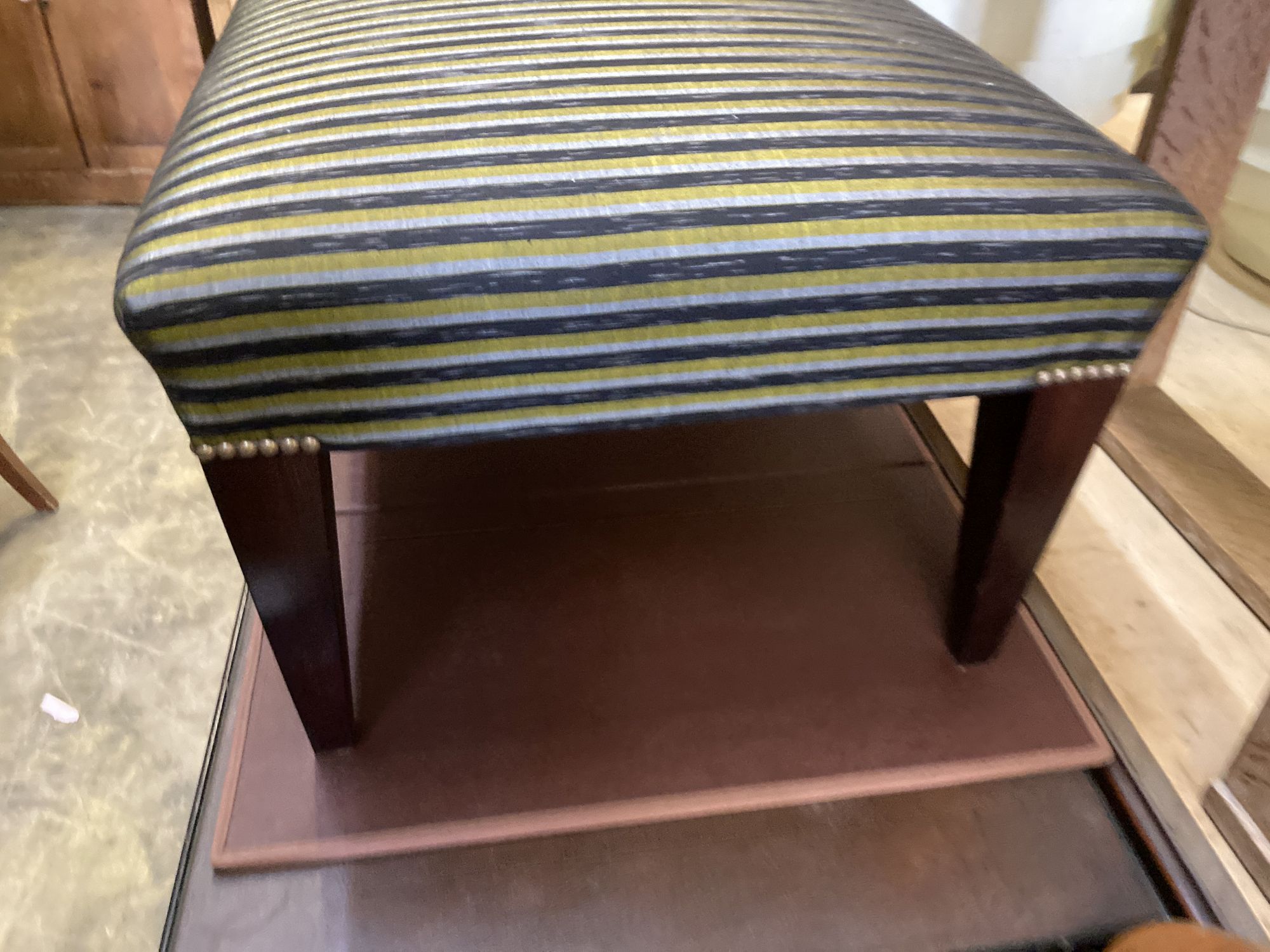 A modern rectangular footstool on square tapered legs, width 100cm, depth 56cm, height 38cm